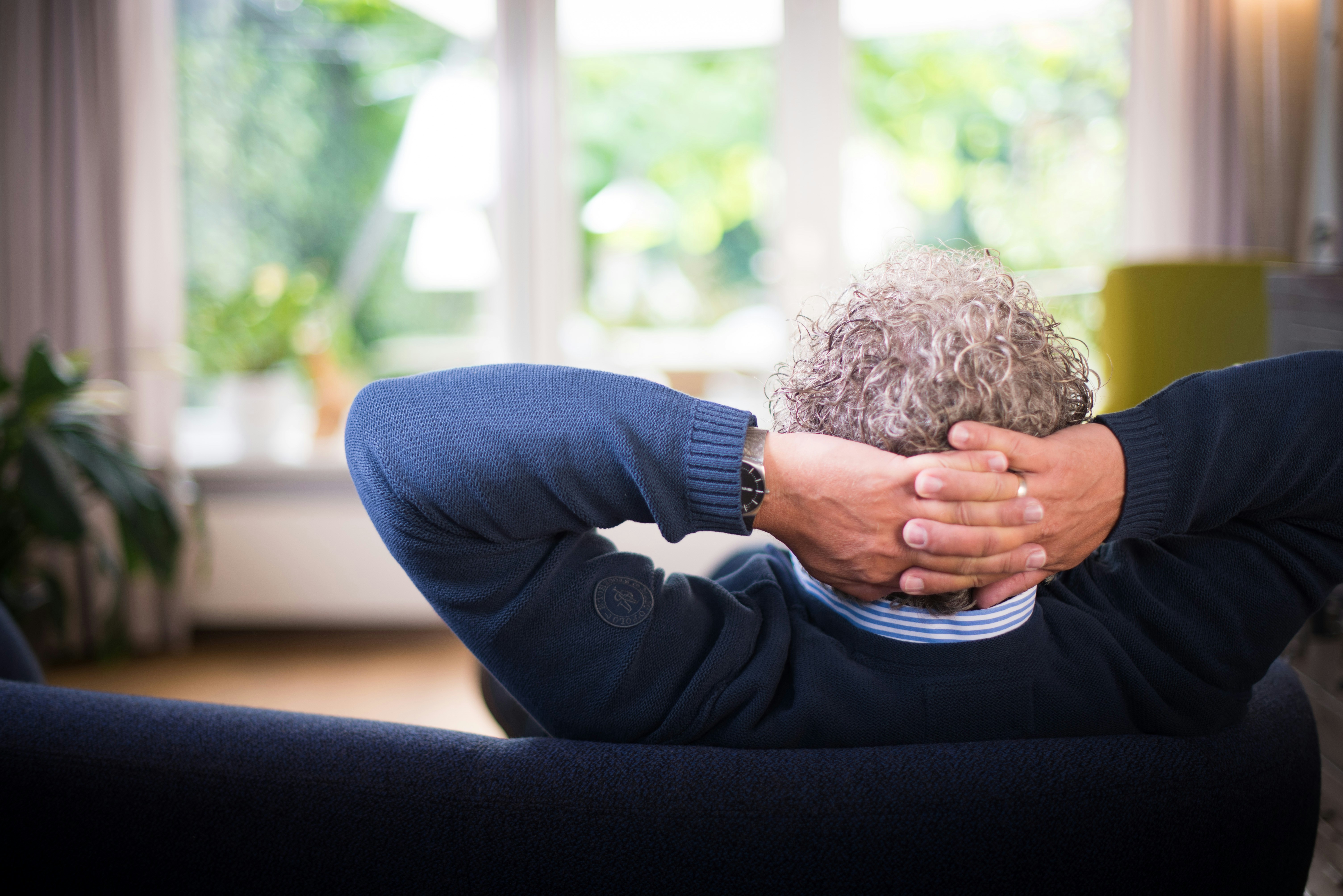 Man relaxing, thinking about the future