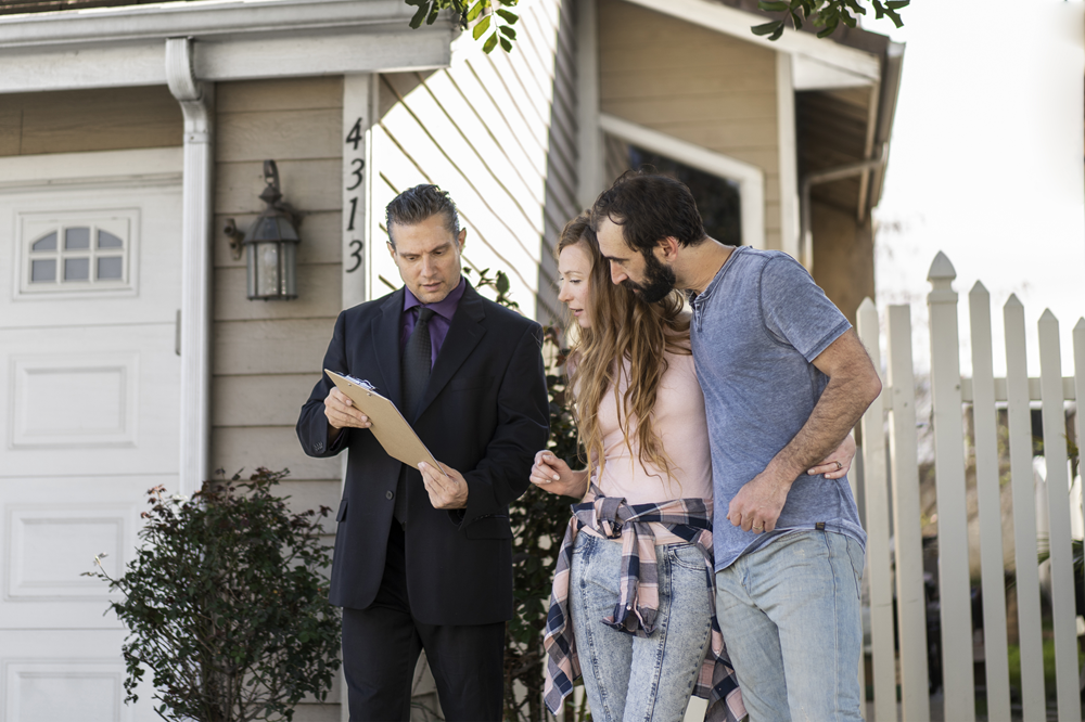couple speaking with a contractor